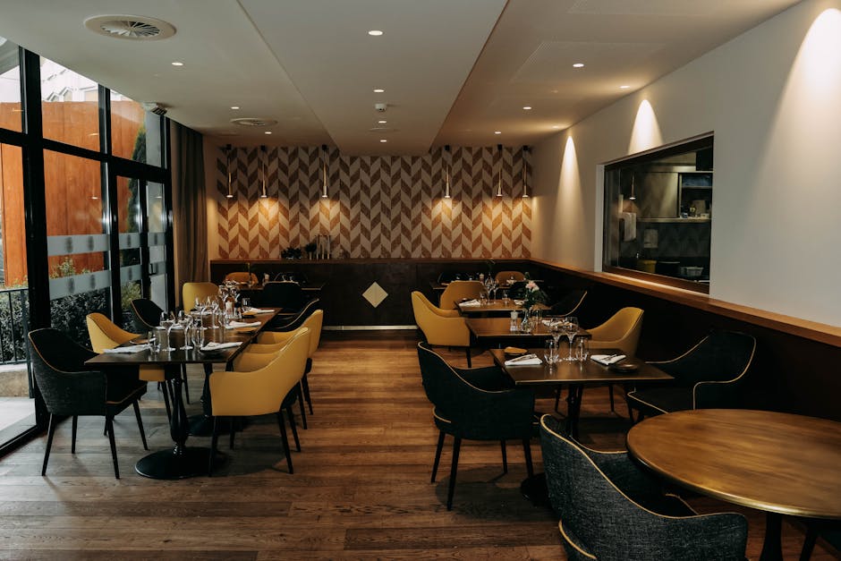 Stylish restaurant interior featuring modern decor, elegant furniture, and well-set dining tables